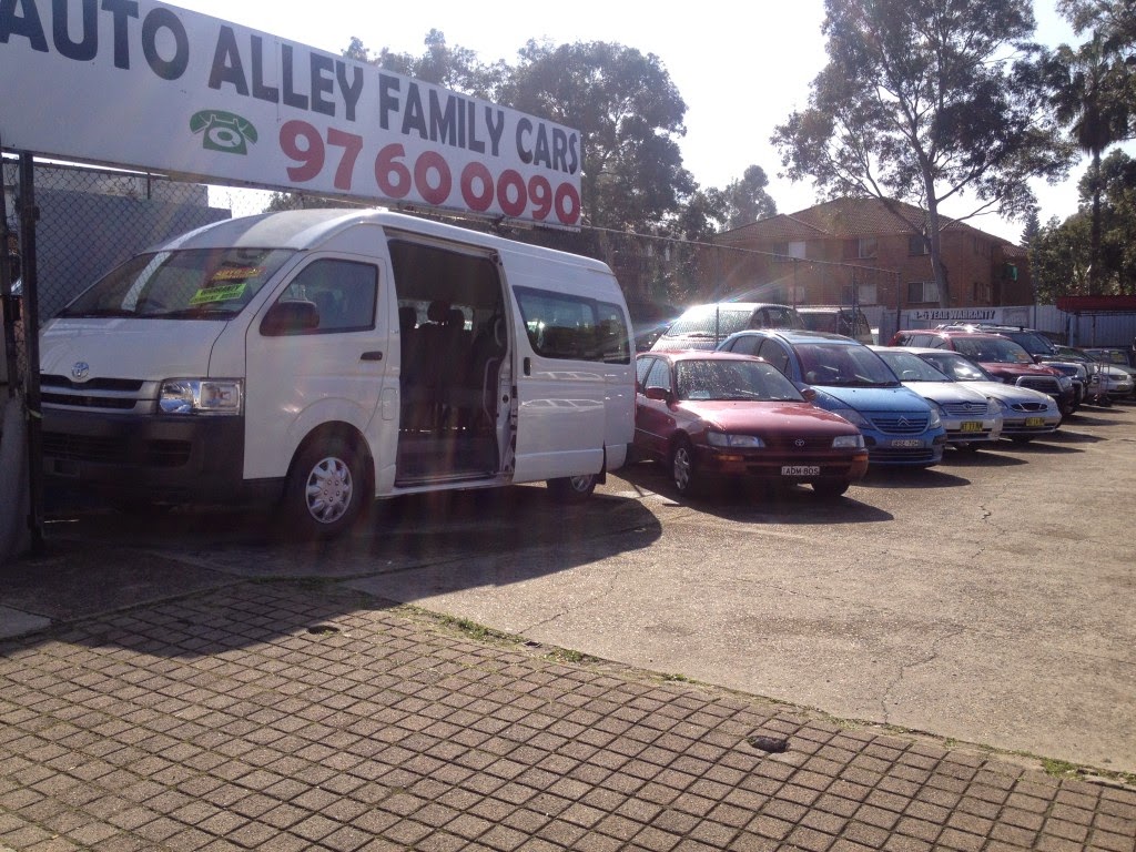 The Auto Alley Family Cars banner and phone number above the front of the yard, with a Hiace and the front row of cars below
